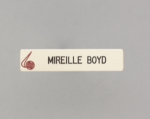 Image: flight attendant name pin: World Airways, Mireille Boyd