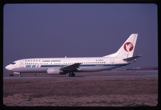Image: slide: China Xinhua Airlines, Boeing 737-400, Beijing Capital International Airport (PEK)