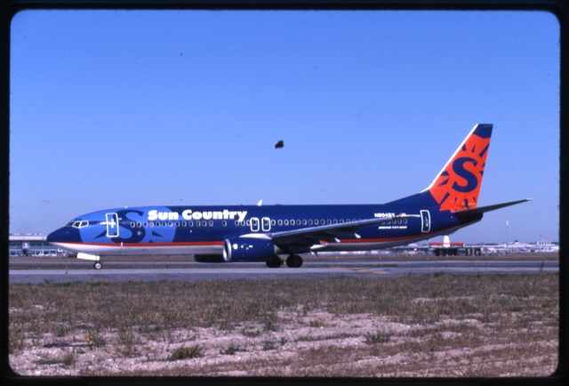 Slide: Sun Country Airlines, Boeing 737-800, John F. Kennedy International Airport (JFK)