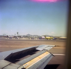 Image: negative: landing view from airplane window on runway, Phoenix Sky Harbor International Airport (PHX)