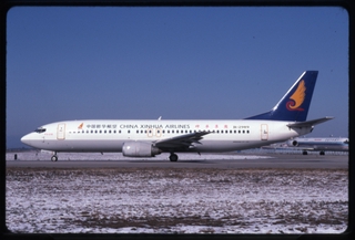 Image: slide: China Xinhua Airlines, Boeing 737-400, Beijing Capital International Airport (PEK)