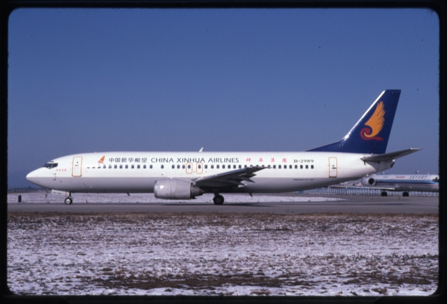 Slide: China Xinhua Airlines, Boeing 737-400, Beijing Capital International Airport (PEK)