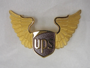 Image: flight officer cap badge: UPS Cargo