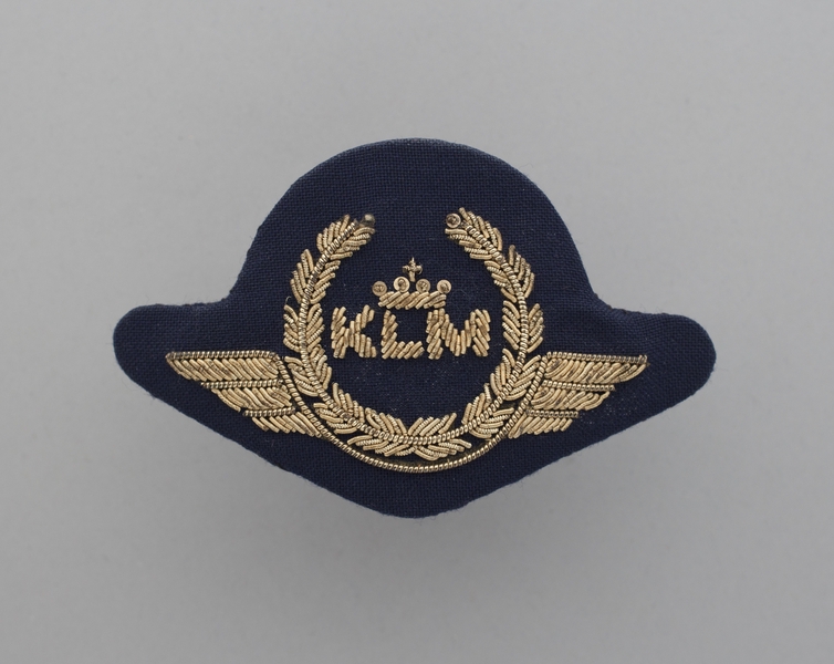 Image: flight officer cap badge: KLM (Royal Dutch Airlines)