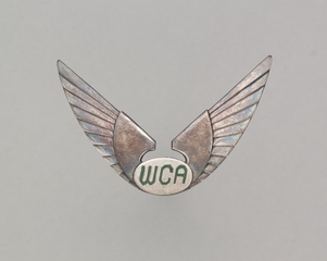 Image: flight officer cap badge: West Coast Airlines