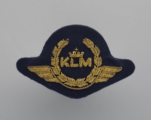 Image: flight officer cap badge: KLM (Royal Dutch Airlines)