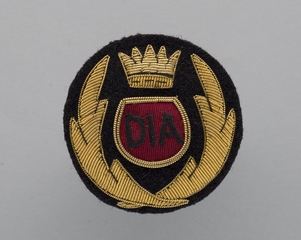 Image: flight officer cap badge: Donaldson International Airways