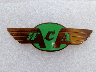 Image: flight officer cap badge: West Coast Airlines