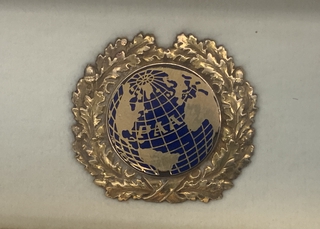 Image: flight officer cap badge: Pan American Airways