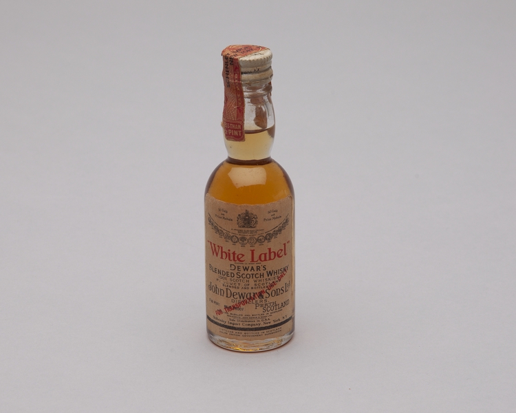 Image: miniature liquor bottle: general commercial aviation, Dewar’s White Label
