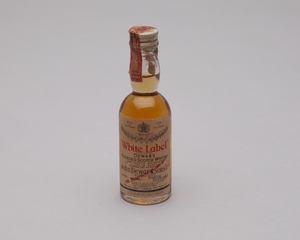 Image: miniature liquor bottle: general commercial aviation, Dewar’s White Label