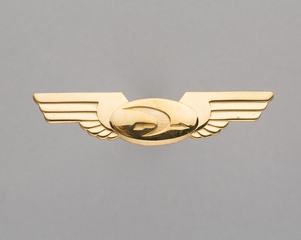 Image: flight attendant wings: Frontier Airlines