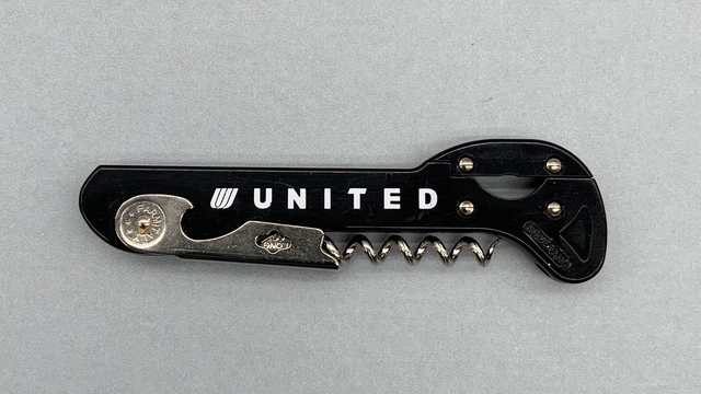 Corkscrew and bottle operer: United Airlines