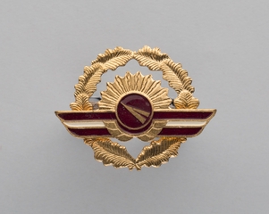 Image: flight officer cap badge: Latvio  (Latvian Airlines)