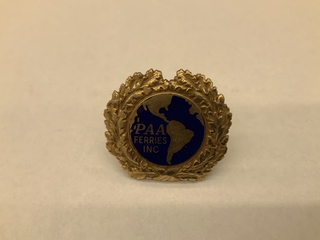 Image: flight officer cap badge: Pan American Africa