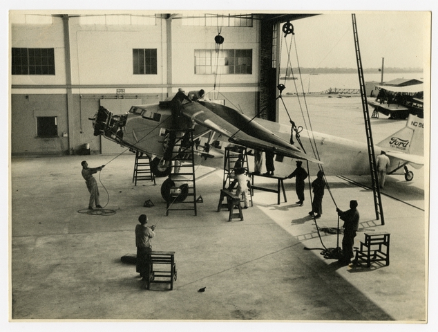 Photograph: Ford Tri-Motor under construction in hangar, CNAC (China National Aviation Corporation)