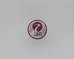 Image: service crew cap badge: Japan Air Lines, cargo agent 