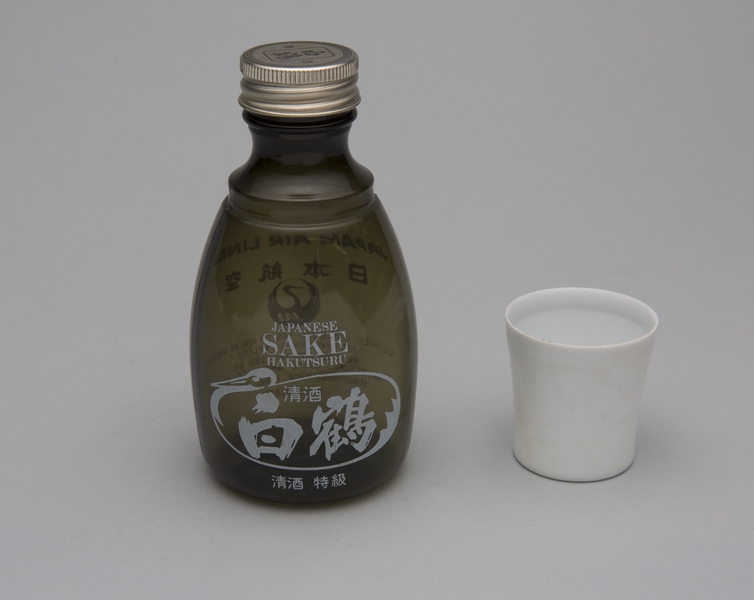 Image: sake bottle and cup: Japan Air Lines