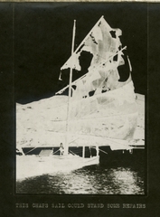 Image: negative print: junk with torn sails
